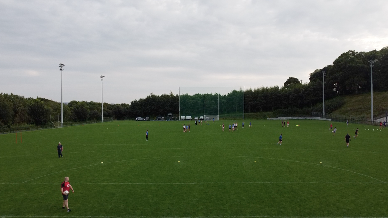 Evening training session on the finished Kenny Park pitch, with the floodlight masts up